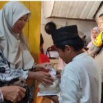 Penyerahan santunan pada anak yatim